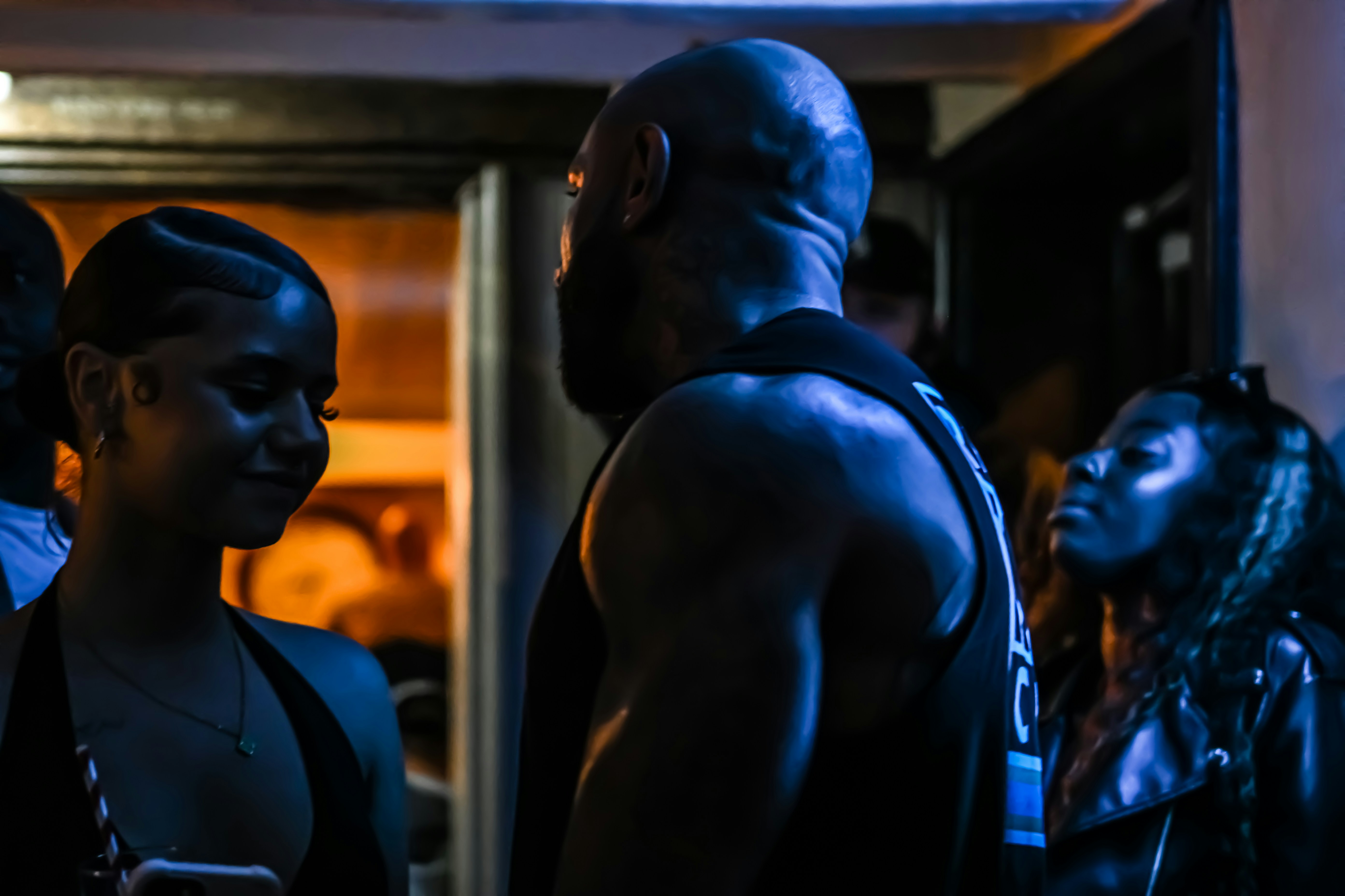 a group of people standing around each other