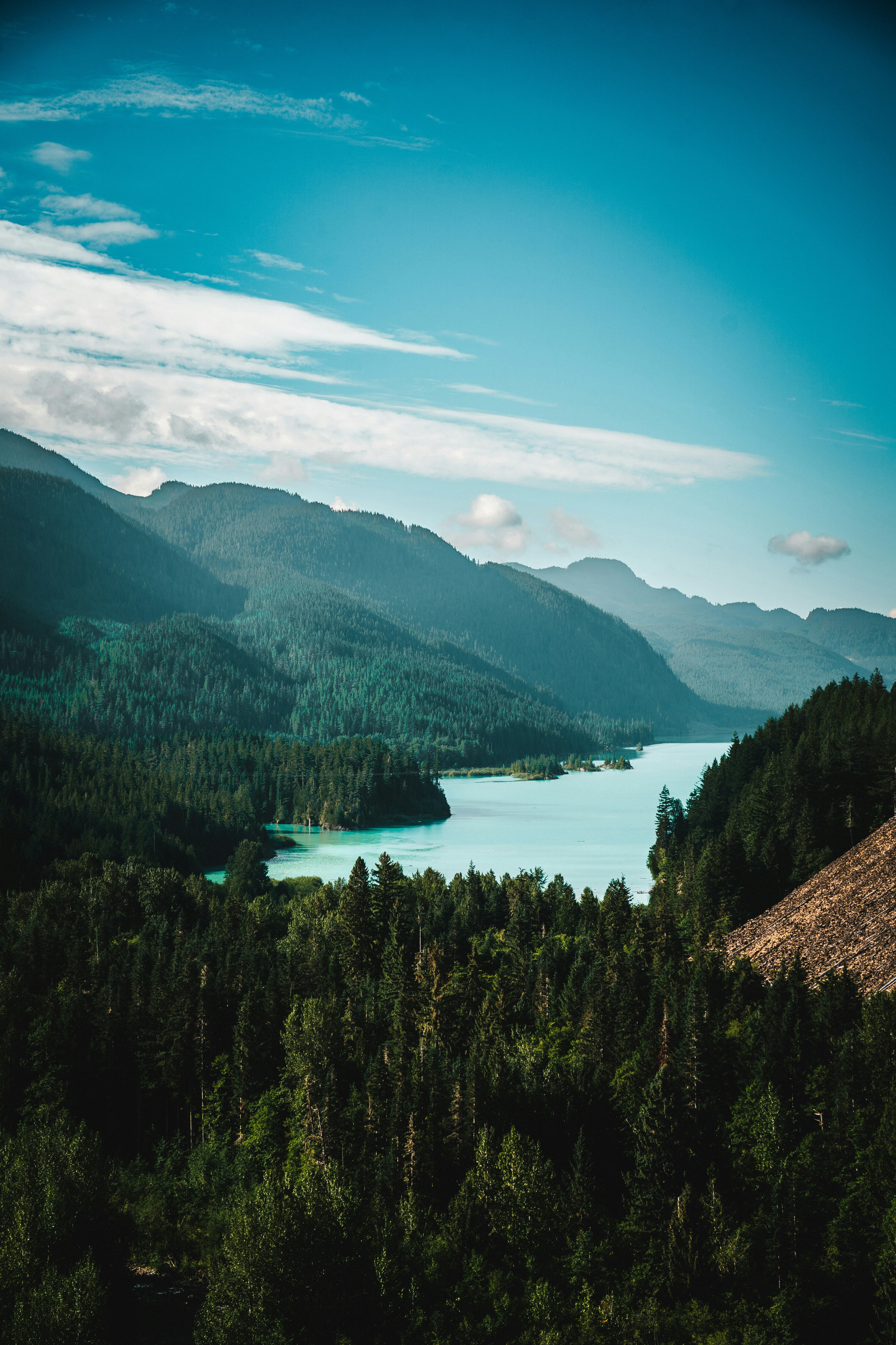 A scenic view of a lake surrounded by mountains photo – Free Whistler ...