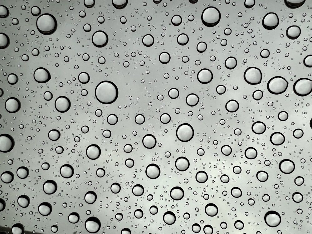 a close up of a window with water drops on it