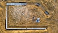 A panoramic view of a large concrete slab installation at a construction site.