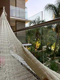 Charming courtyard with tropical plants and a hammock inviting relaxation