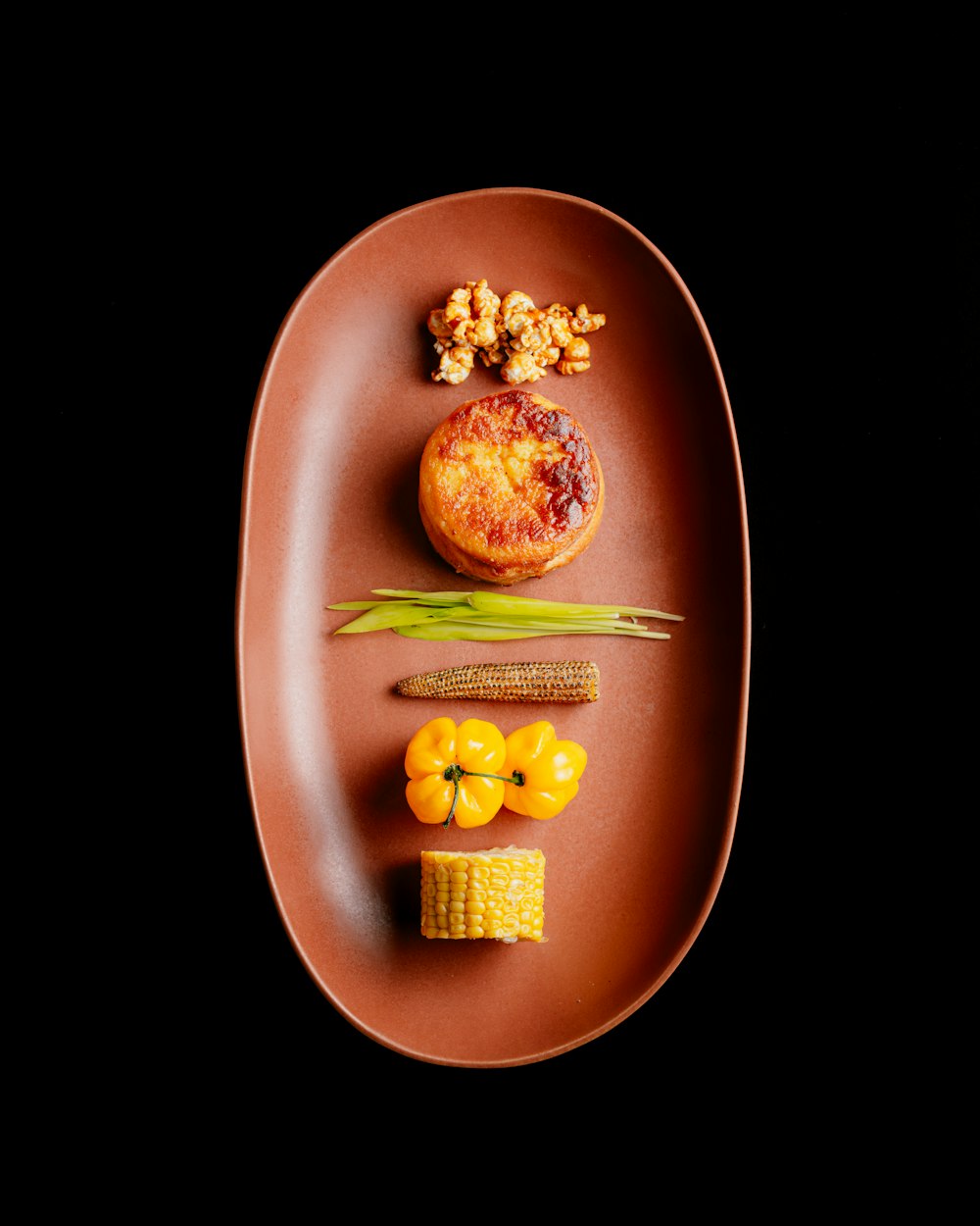 a plate of food on a black background
