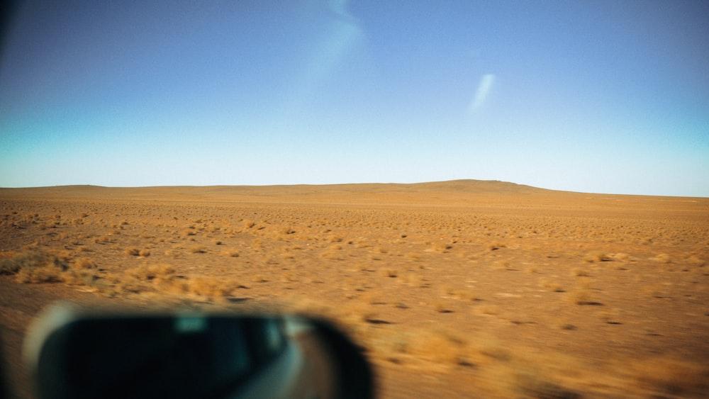 a view of a desert from a vehicle window