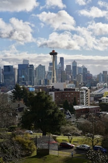 A vibrant cityscape showcasing the skyline of Seattle alongside traditional architecture from Daejeon, symbolizing cultural connection.