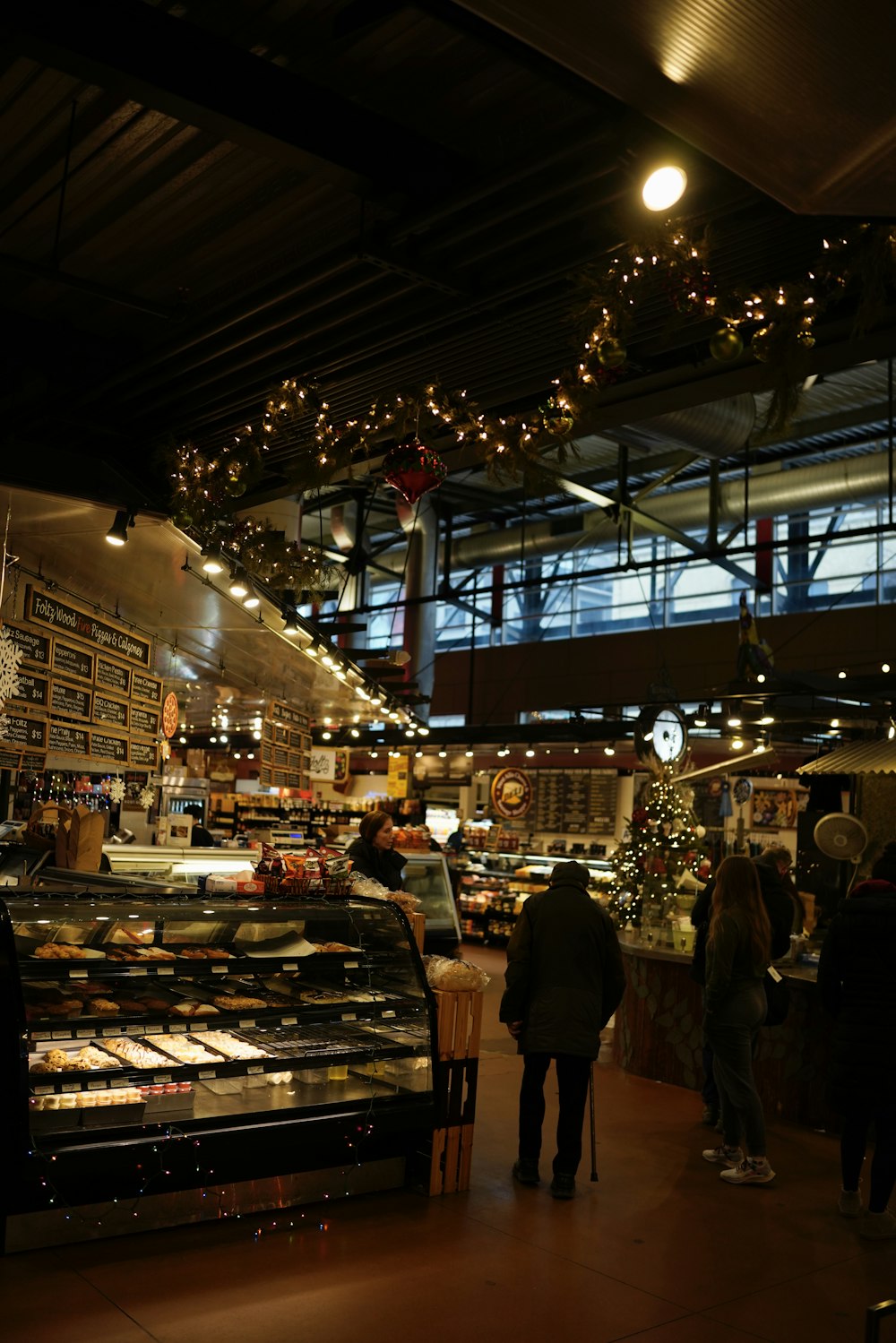 a store filled with lots of food and people