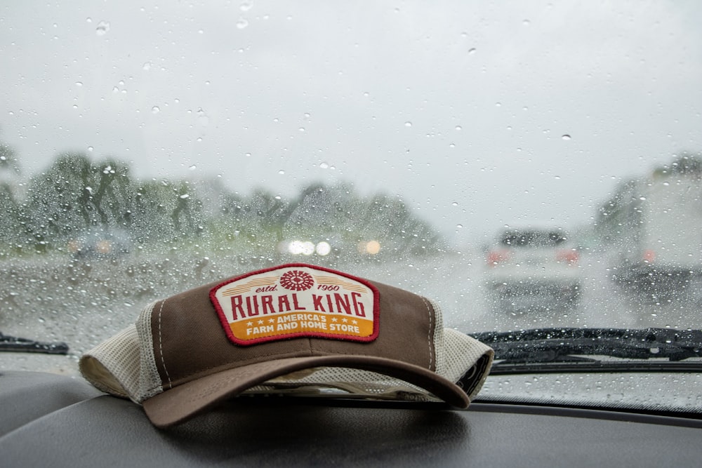 a hat sitting on the dashboard of a car