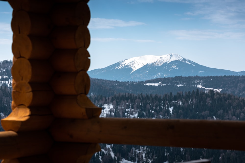 a view of a snowy mountain from a balcony
