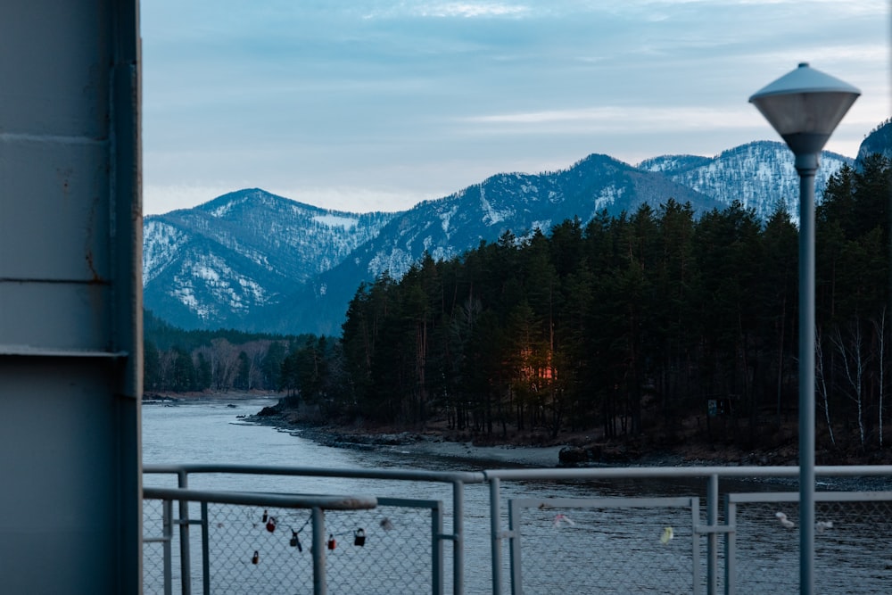 a view of a river and mountains from a bridge