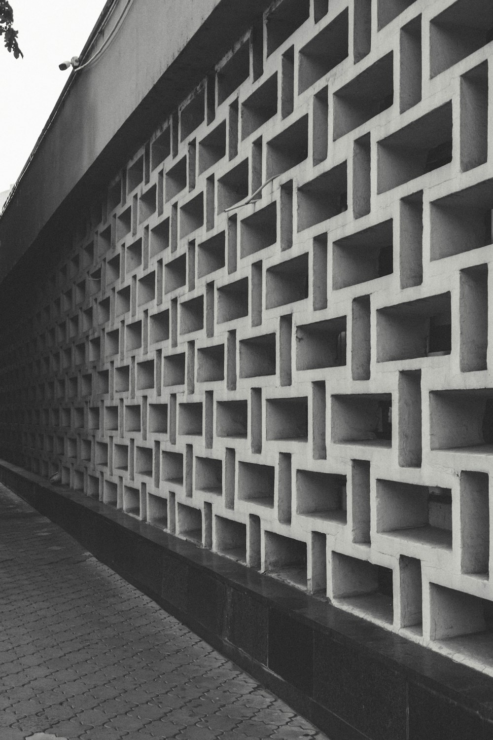 a black and white photo of a brick wall