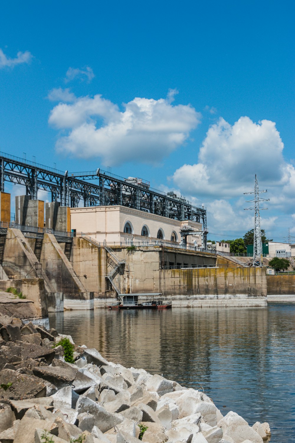 a large body of water with a bridge in the background