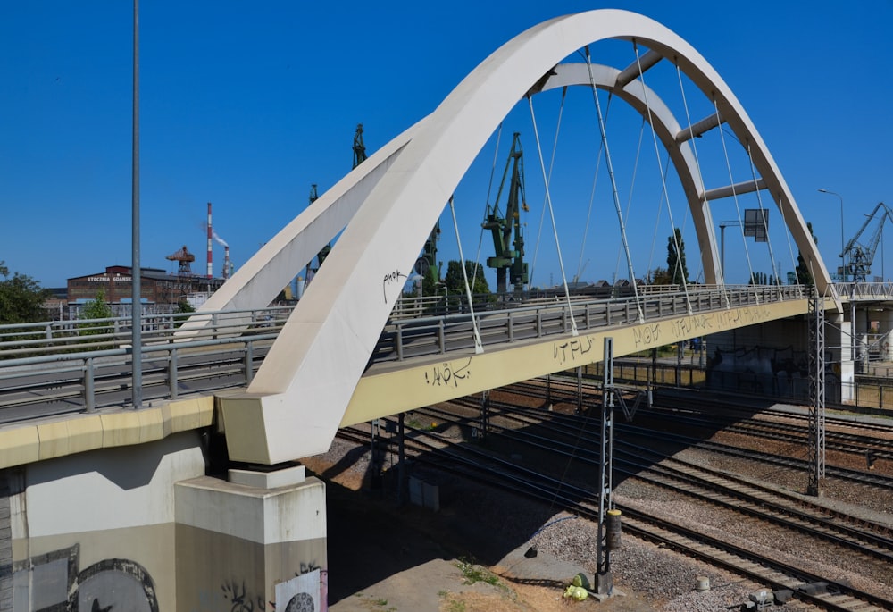 a bridge that has a train track underneath it