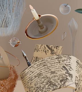 A surreal composition featuring a lit candle on a holder, a futuristic silver pen resting on papers with intricate handwriting, an apple with a metallic sheen, and scattered cosmic elements like a planet with rings. The background is a neutral beige tone, creating a sense of floating objects in space.