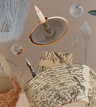 A surreal composition featuring a lit candle on a holder, a futuristic silver pen resting on papers with intricate handwriting, an apple with a metallic sheen, and scattered cosmic elements like a planet with rings. The background is a neutral beige tone, creating a sense of floating objects in space.