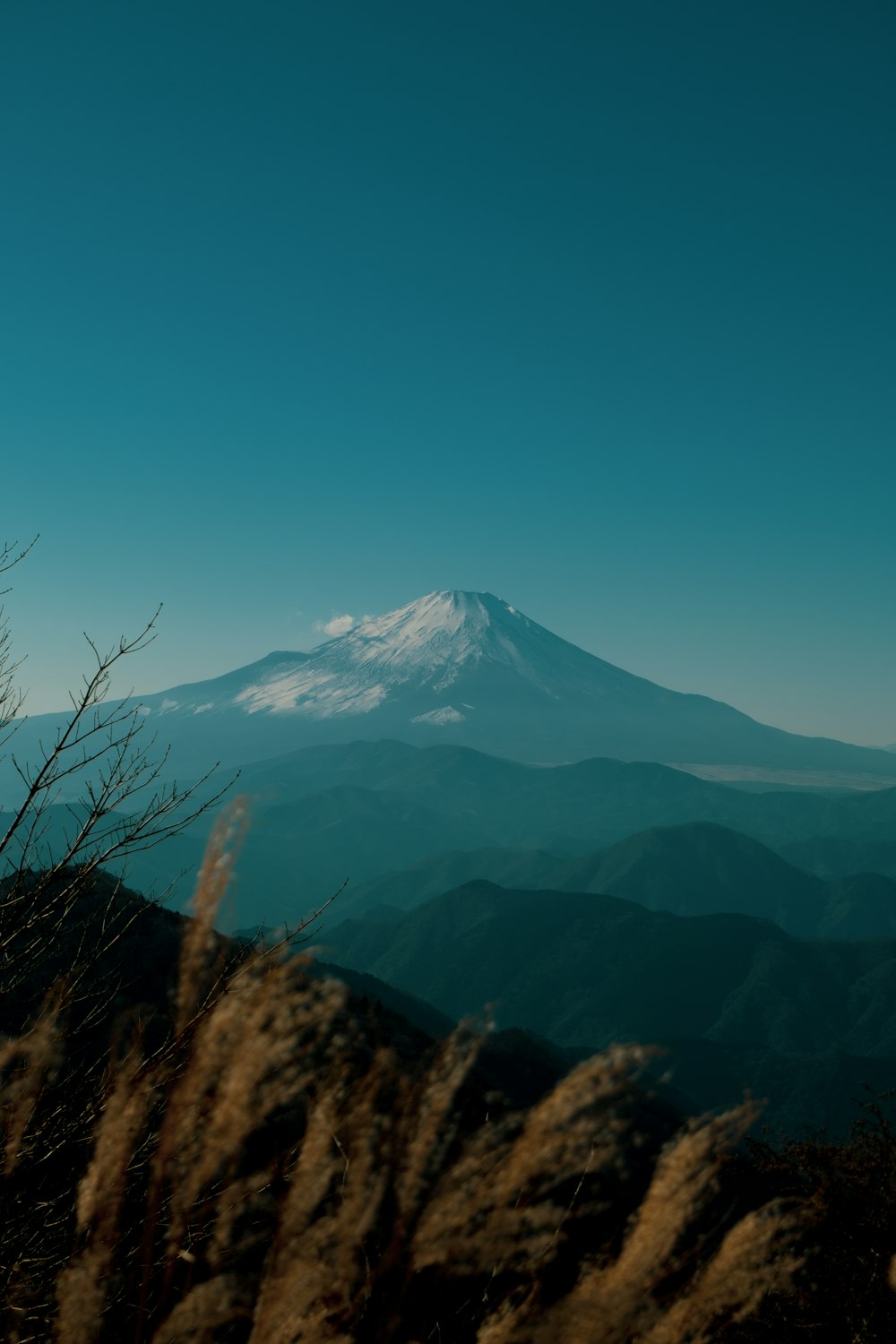 a view of a snow capped mountain in the distance