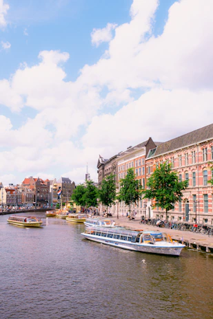 A scenic view of Amsterdam’s historic bridges and waterways, perfect for a city ride.