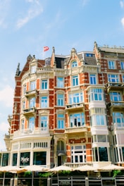 A warm, inviting photo of Marie welcoming guests at a charming seaside home in Brittany.