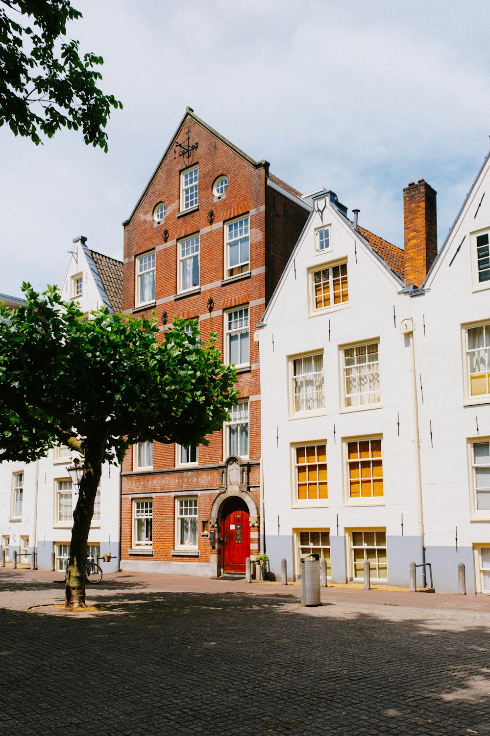 a large white building with a red door