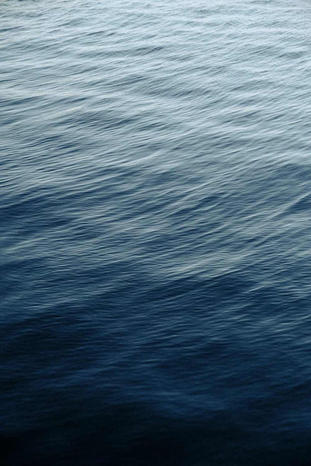 a boat floating on top of a large body of water