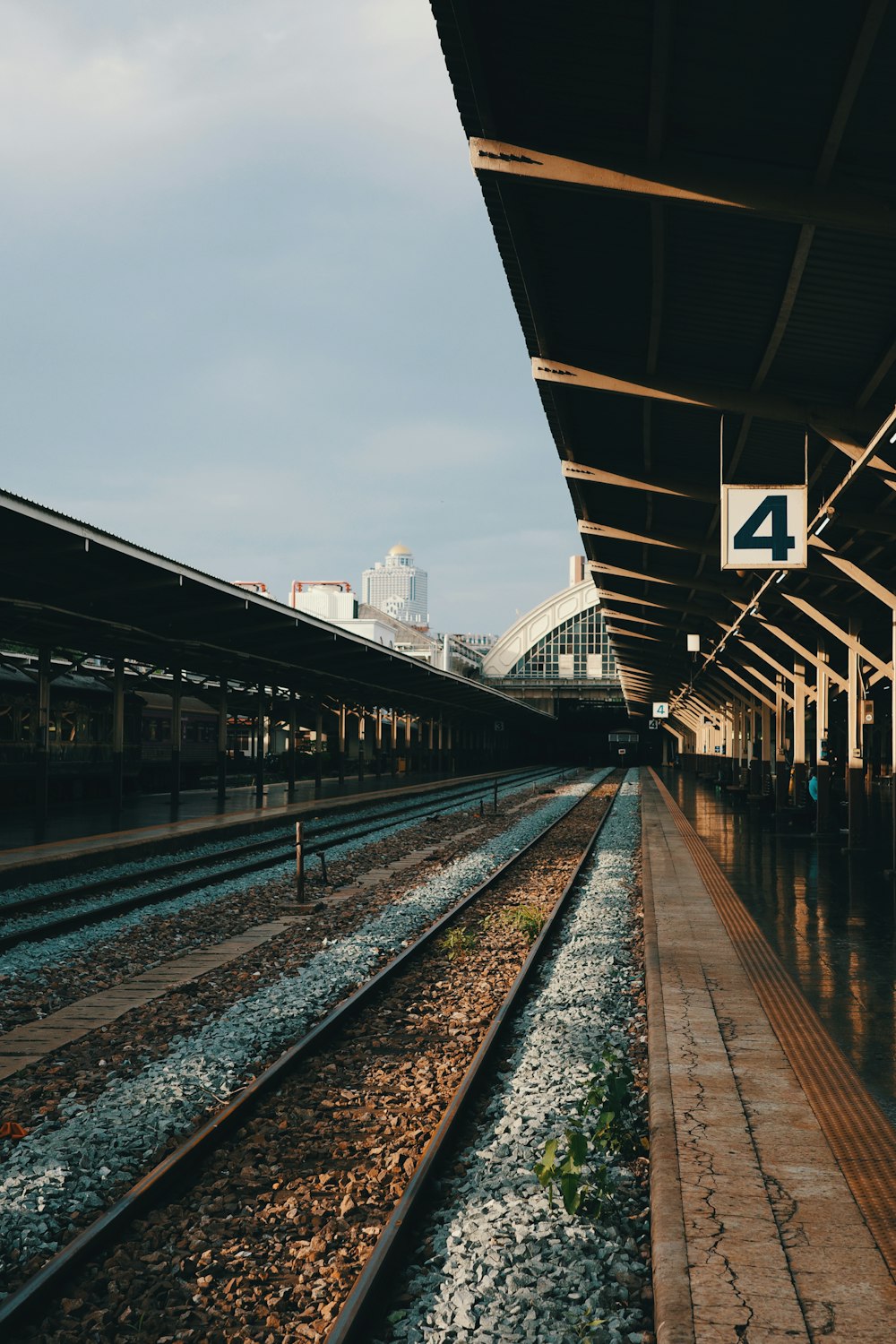 a train station with a train on the tracks