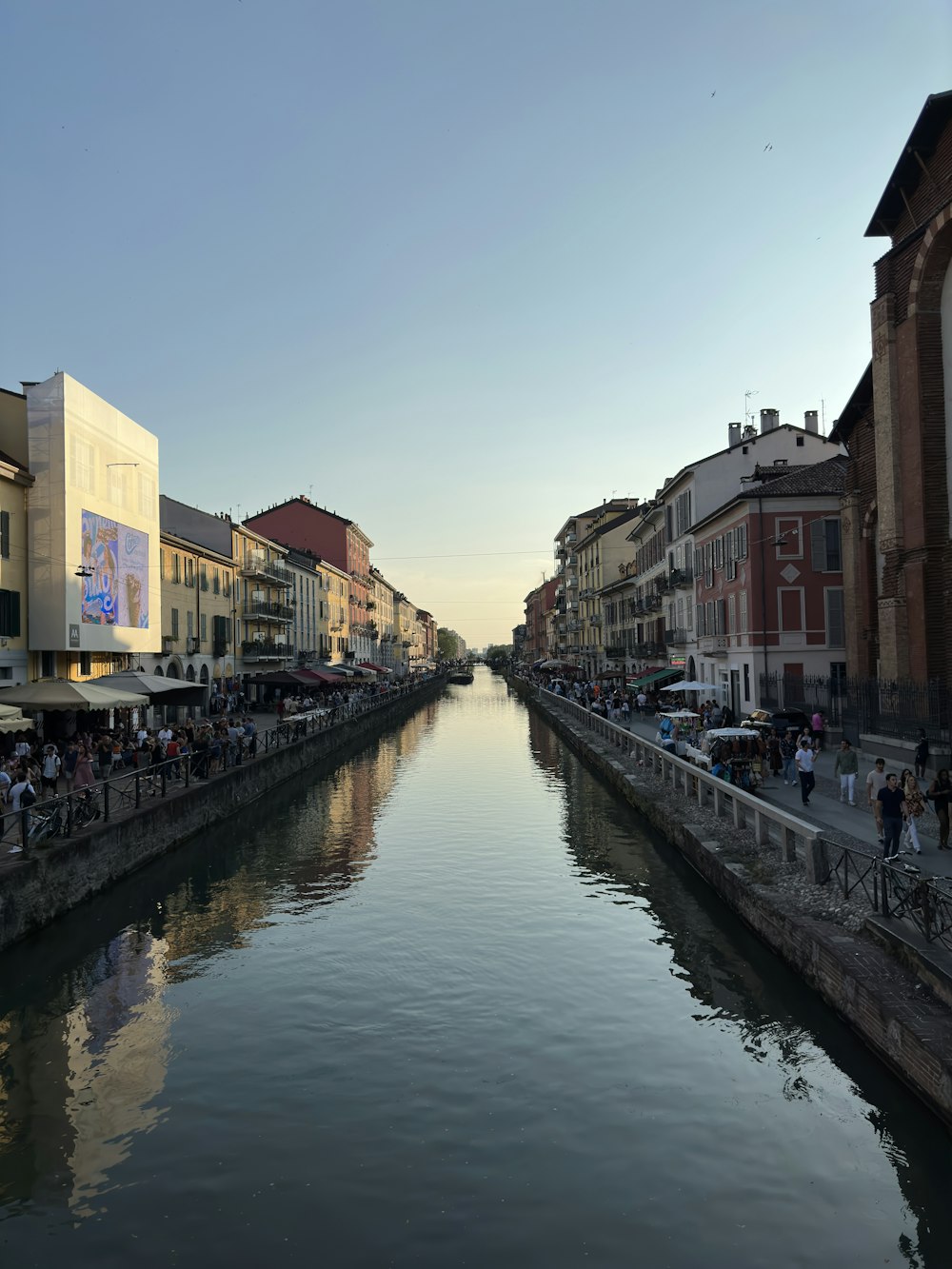 a river running through a city next to tall buildings