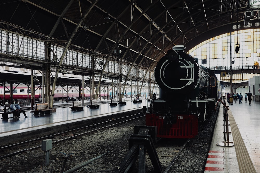 a train is parked inside of a train station