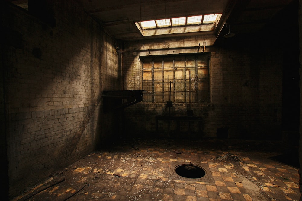 a dark room with a hole in the floor