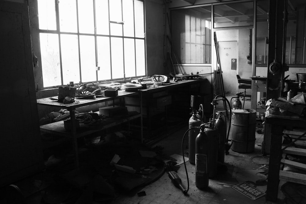 a black and white photo of a room filled with tools