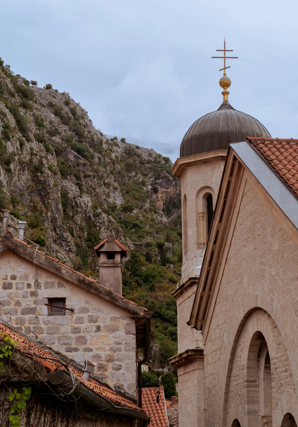 a church with a steeple and a cross on top