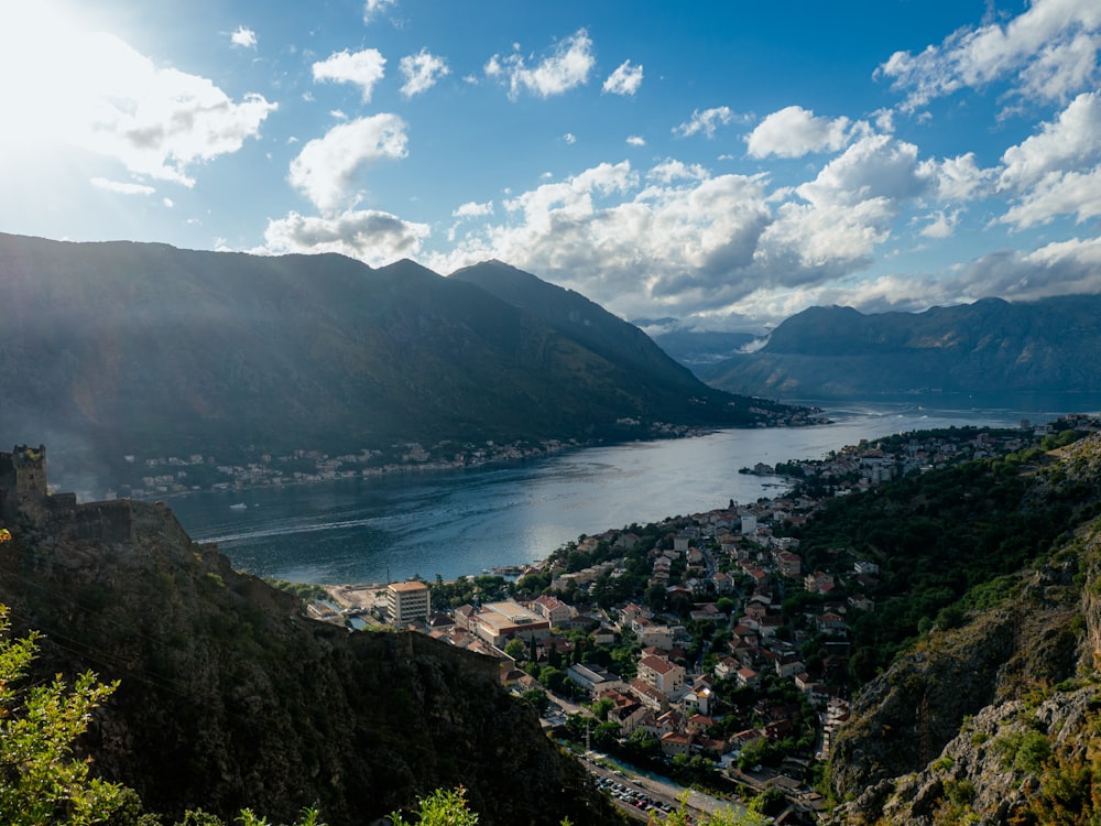 a scenic view of a town and a body of water