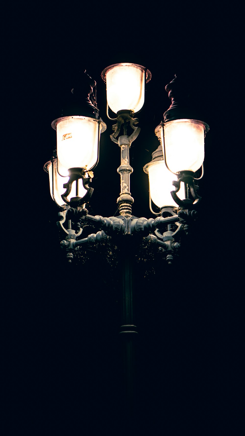 a street light with four lights on it