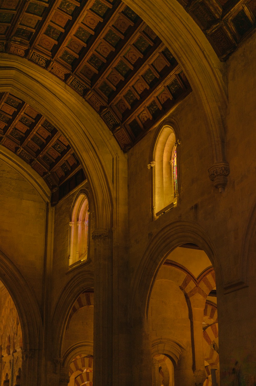 a large cathedral with vaulted ceilings and stained glass windows