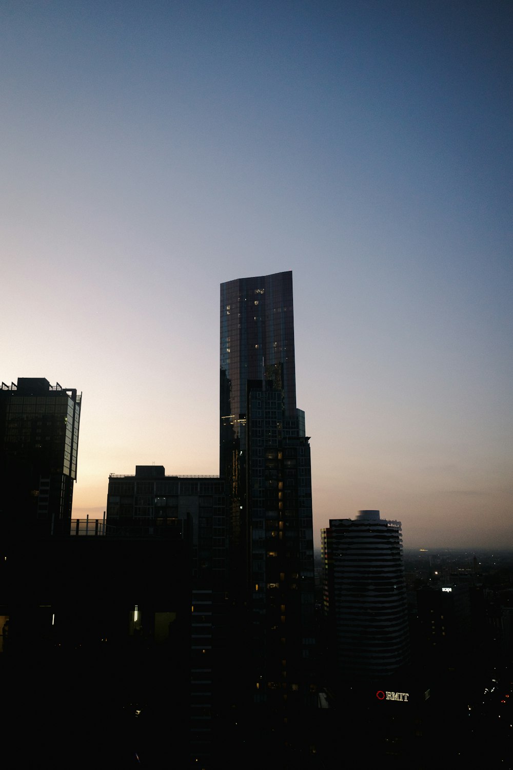 a very tall building towering over a city