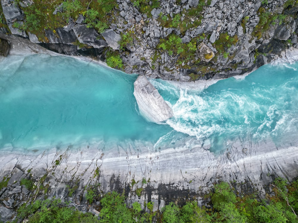 an aerial view of a body of water surrounded by trees