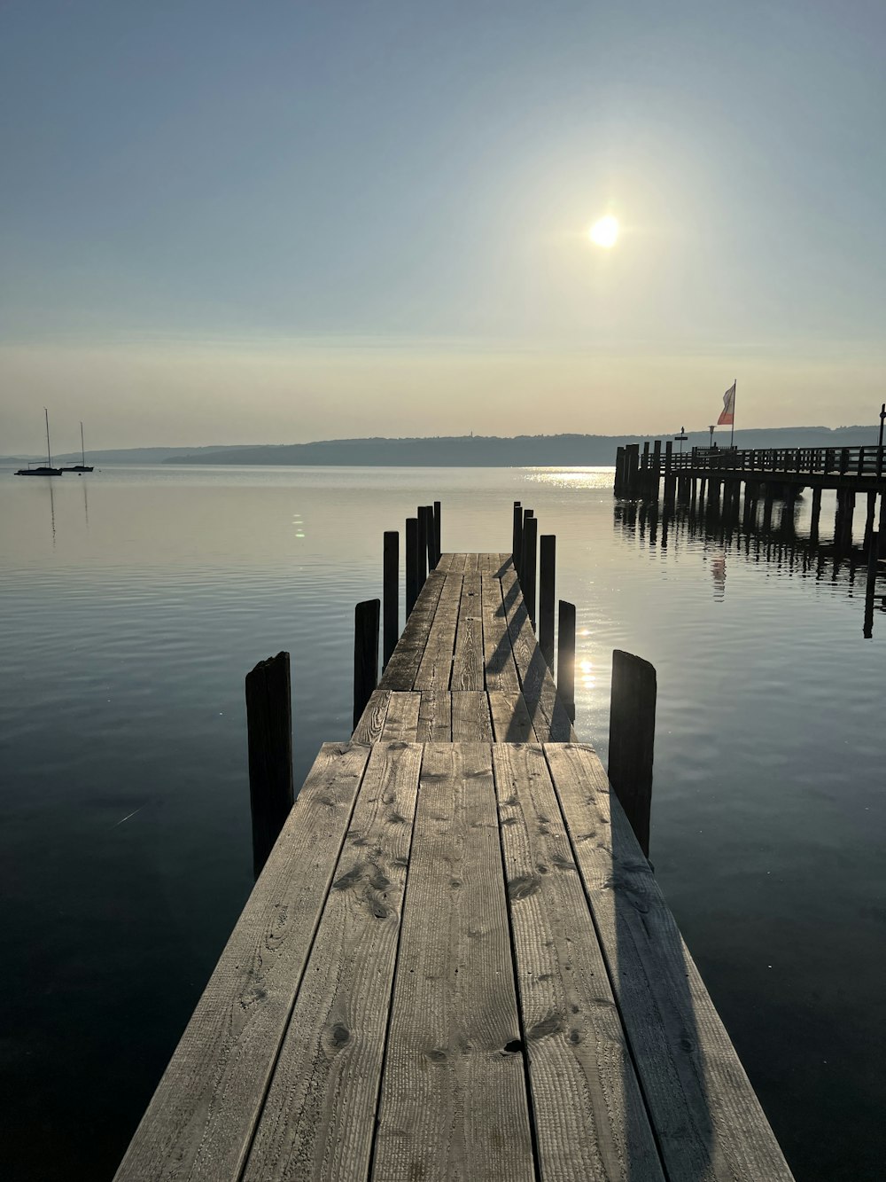 a wooden dock sitting on top of a body of water