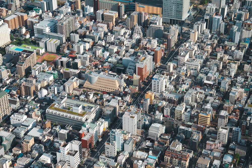 an aerial view of a city with lots of tall buildings