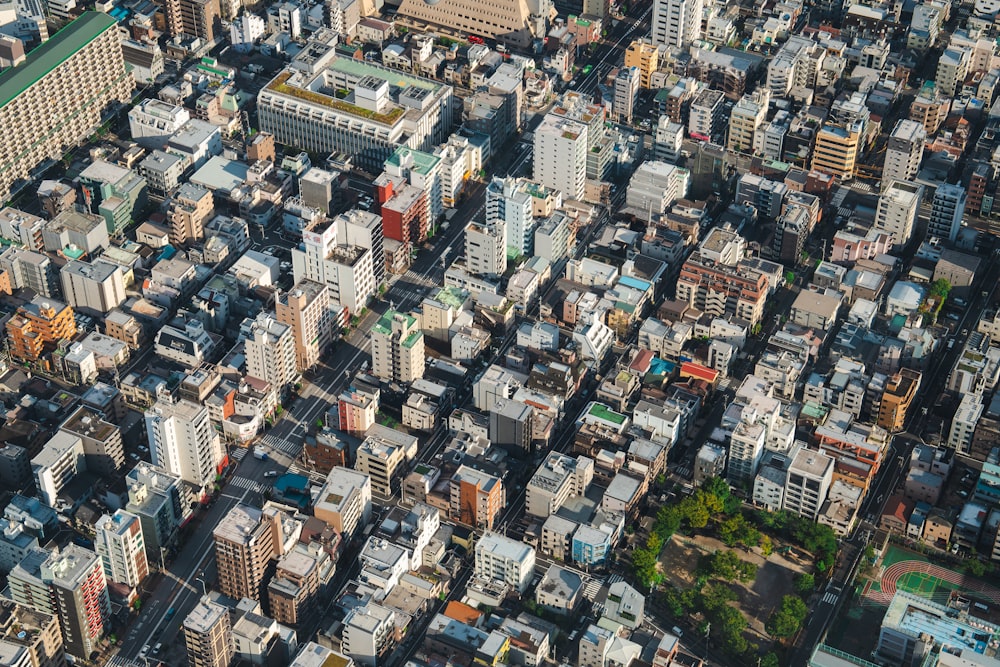 an aerial view of a city with lots of tall buildings