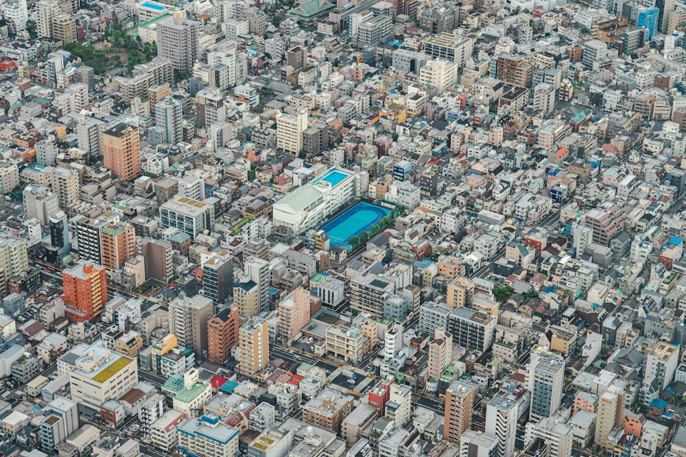 an aerial view of a city with tall buildings