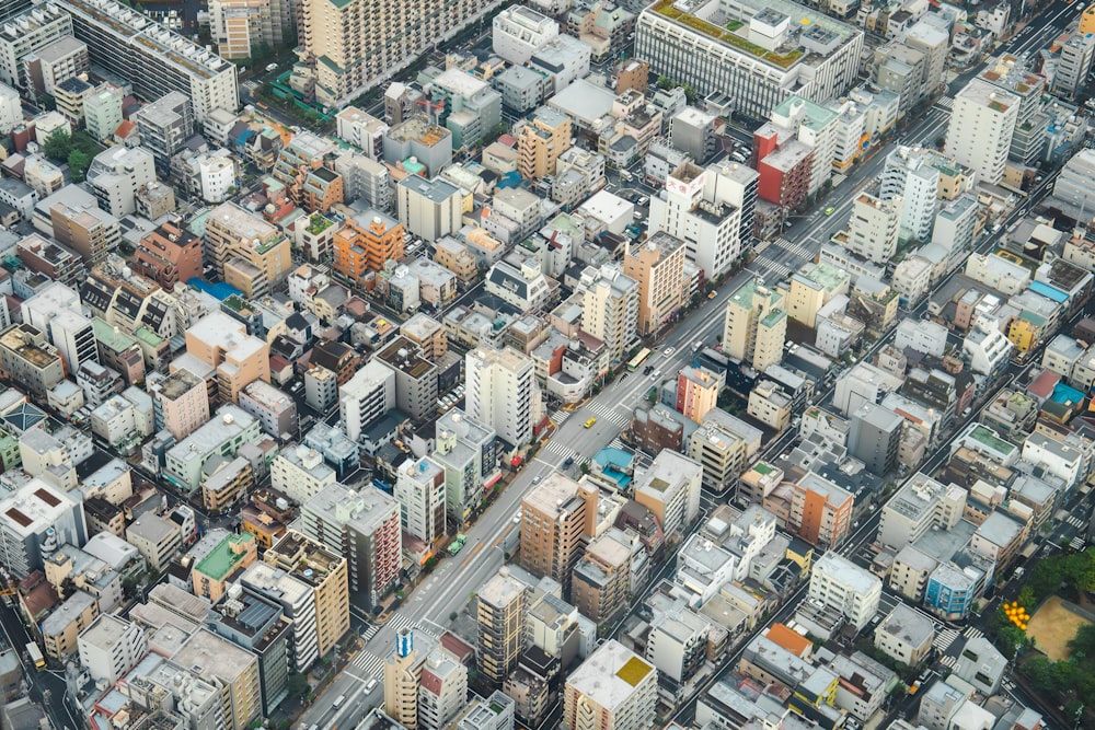 an aerial view of a city with lots of tall buildings