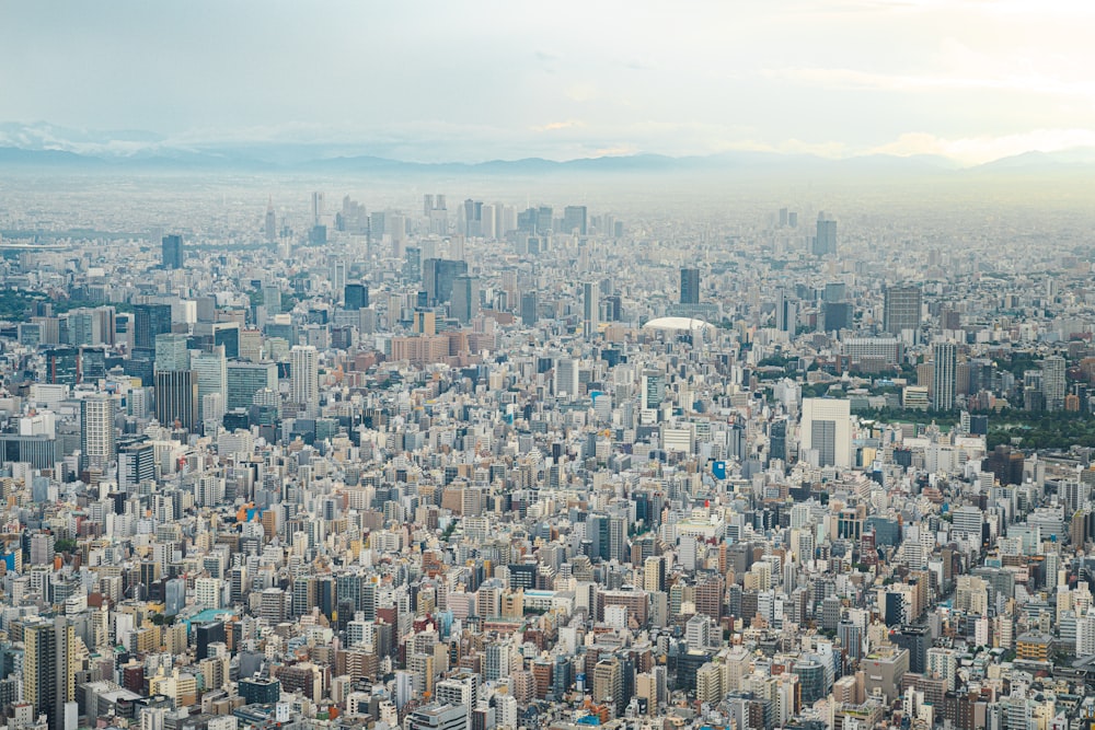 an aerial view of a city with tall buildings