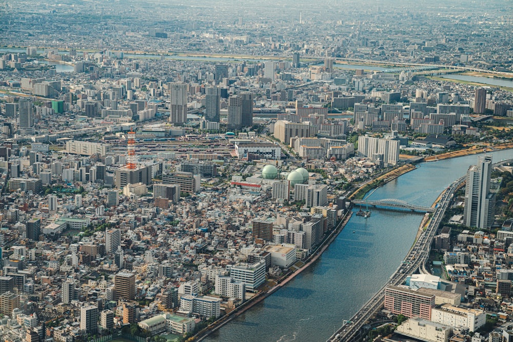 an aerial view of a city with a river running through it