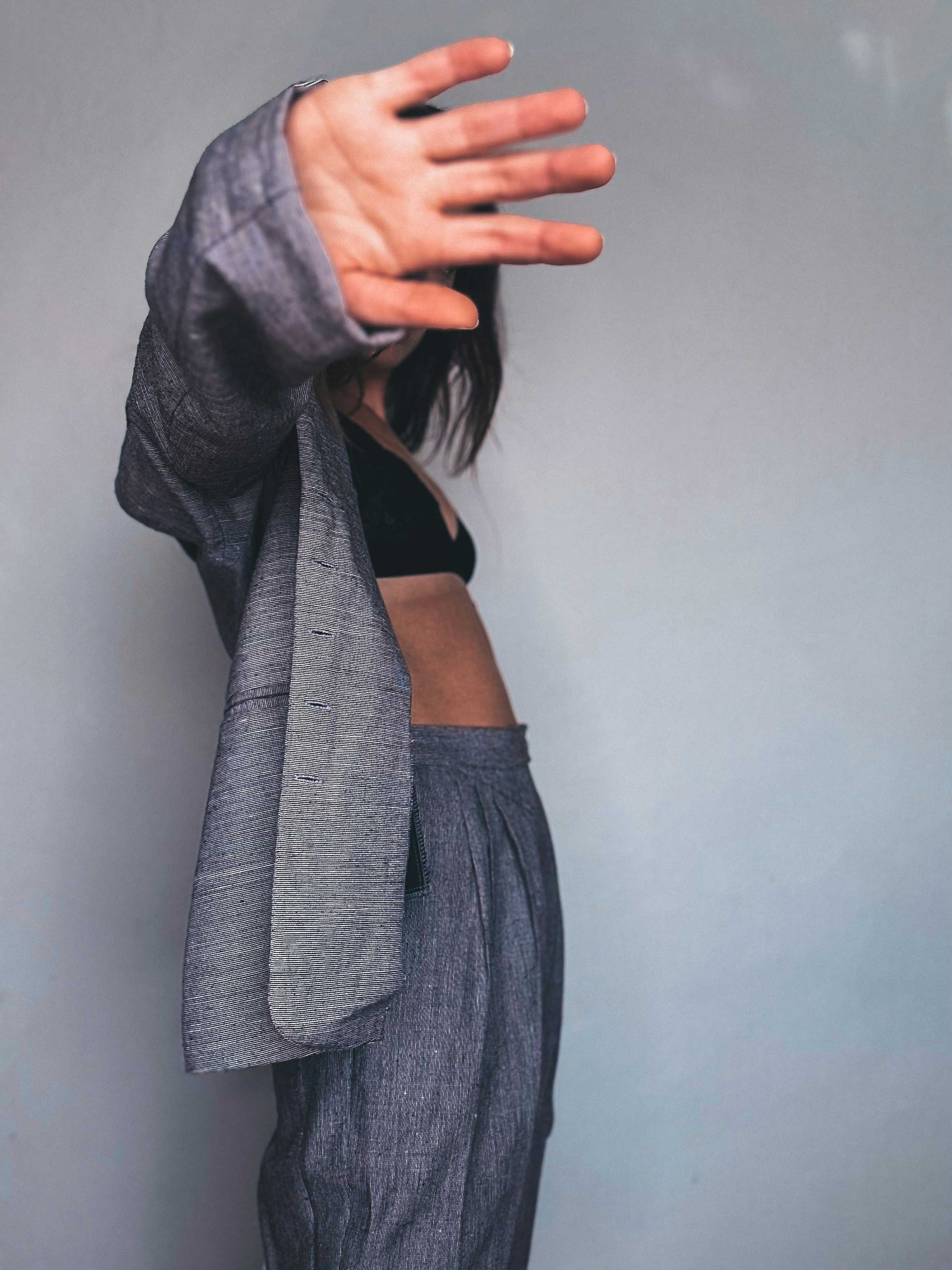 a woman with her hands up in the air