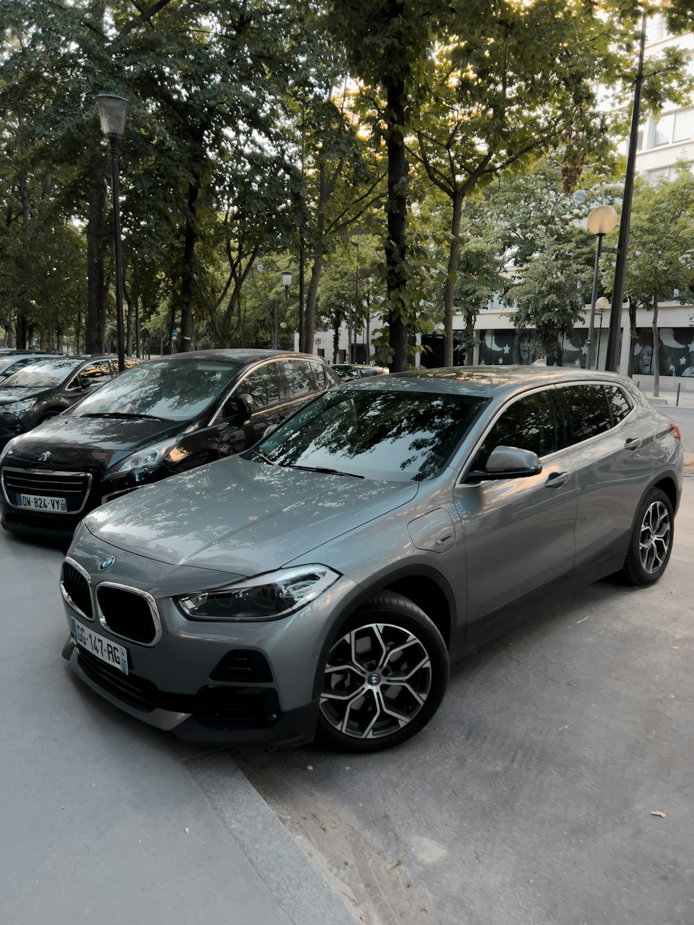 a row of parked cars on a city street