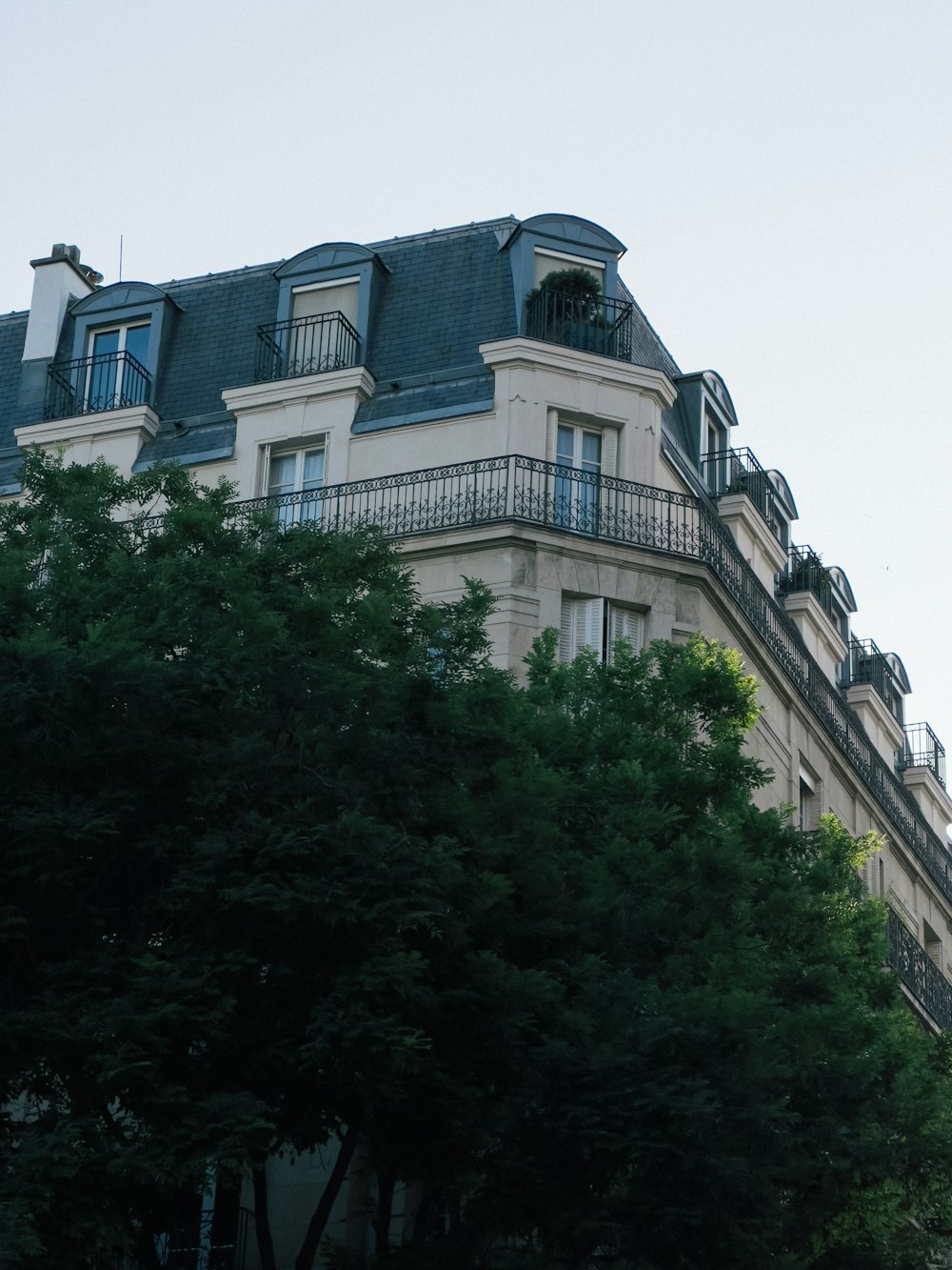 a tall building with a clock on the top of it