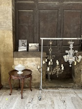 a room with a table and a chandelier