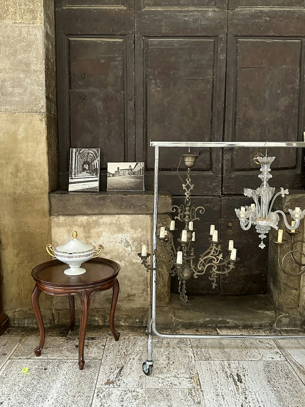 a room with a table and a chandelier