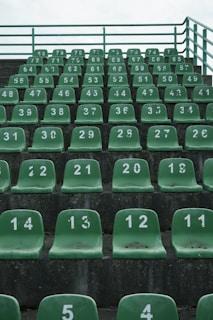 Installation of new seats and fresh concrete being poured in the stands