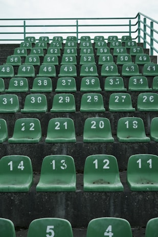 Installation of new seats and fresh concrete being poured in the stands
