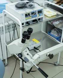 a microscope sitting on top of a white table