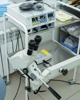 a microscope sitting on top of a white table
