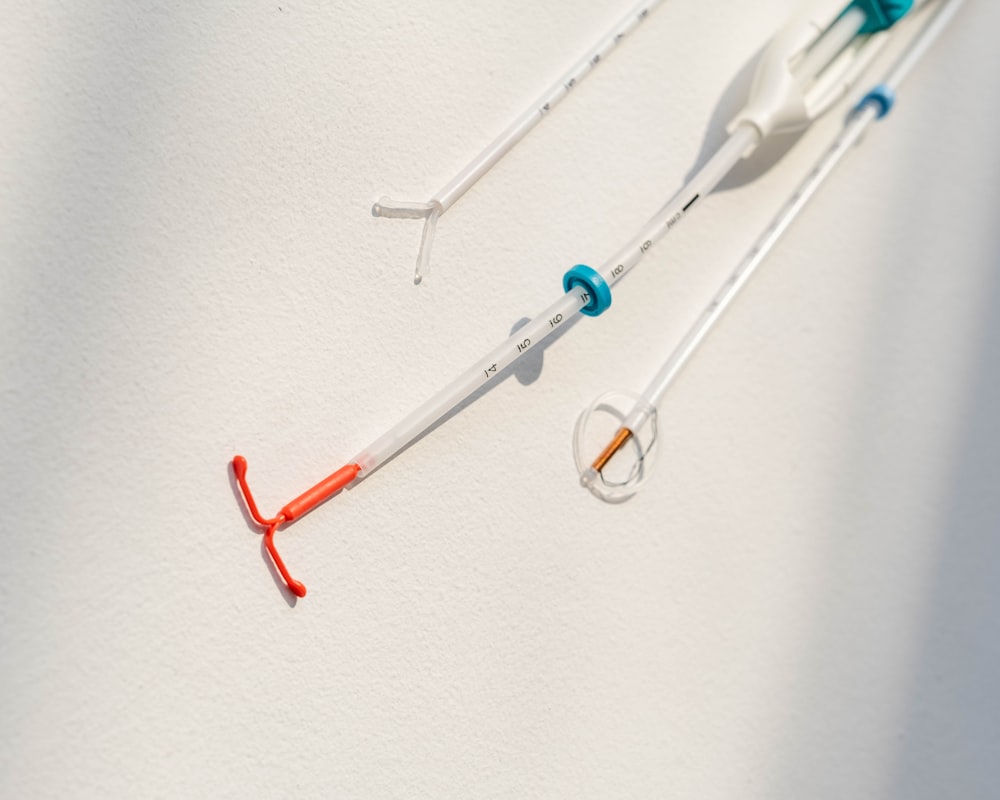 a pair of surgical instruments hanging on a wall